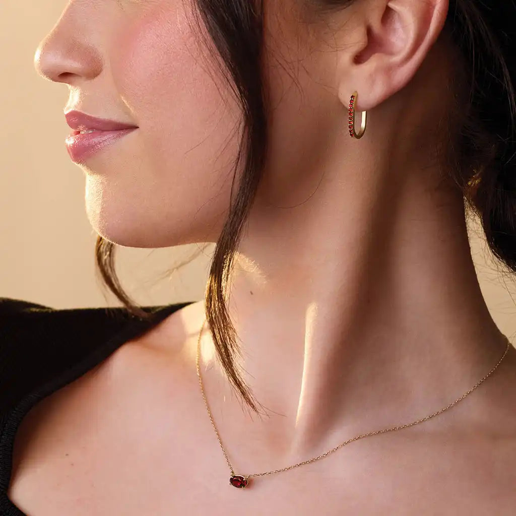 Garnet pendant necklace bezel-set in 14K yellow gold, handcrafted in Colorado