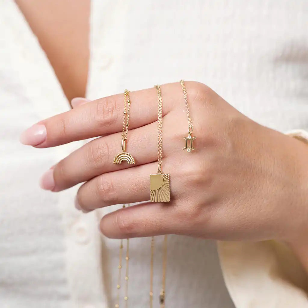 Gemini charm handcrafted in recycled gold