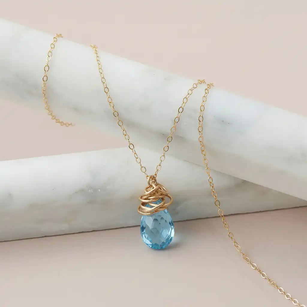 London blue topaz pendant necklace bezel-set in 14K gold