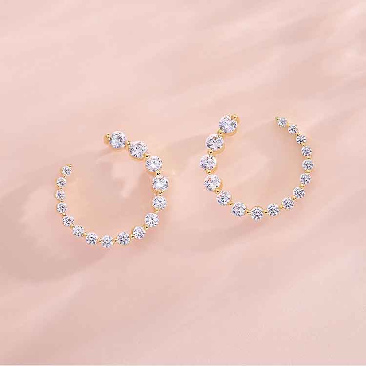 New Erin Gallagher jewelry styled on neutral background