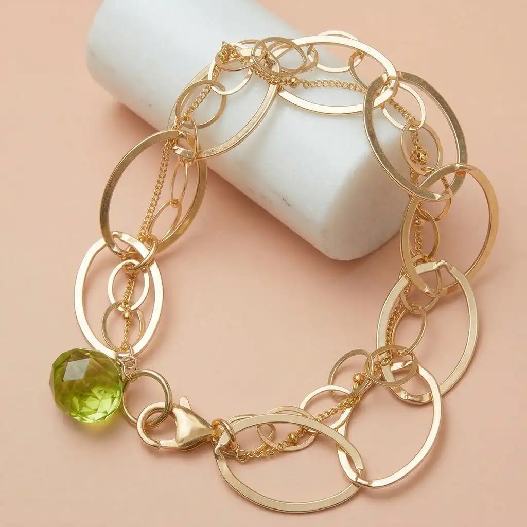 Peridot station bracelet in 14K gold, handcrafted in Colorado
