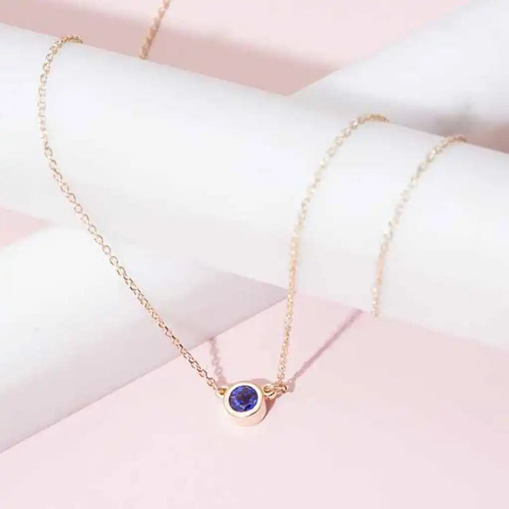 Sapphire pendant necklace bezel-set in 14K gold, handcrafted in Colorado