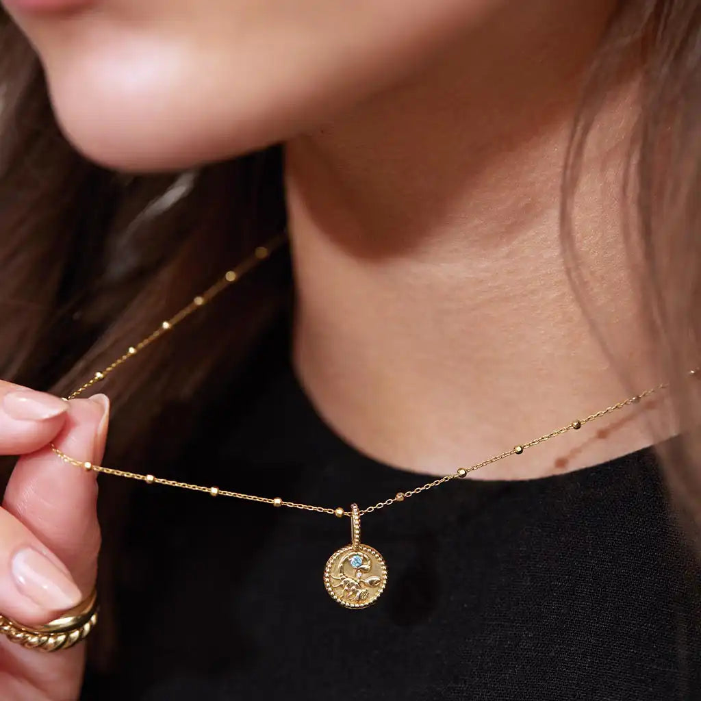 Scorpio zodiac medallion in recycled gold
