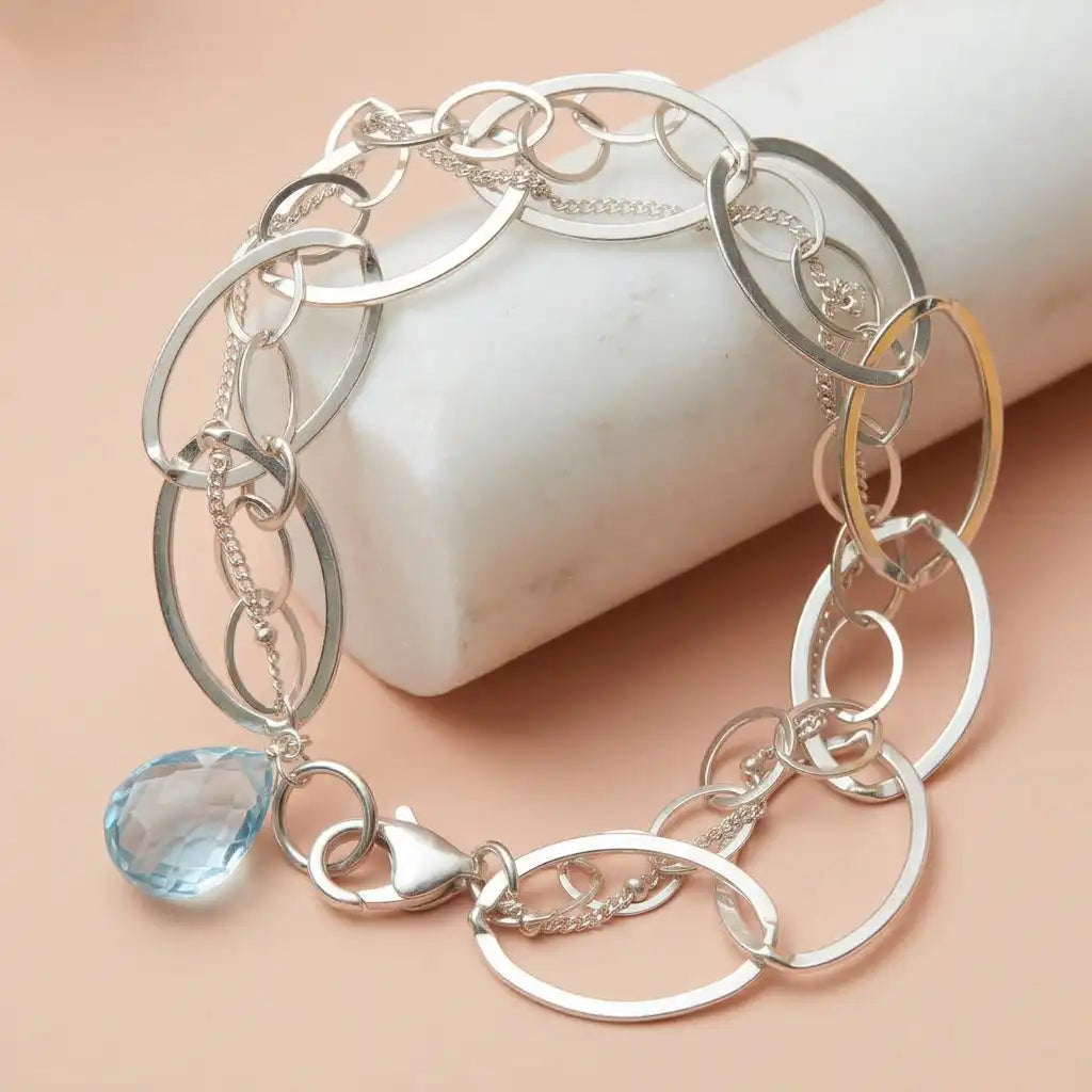 Swiss blue topaz station bracelet in 14K gold, handcrafted in Colorado