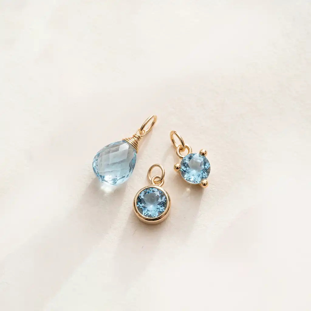 Swiss blue topaz charm in 14K gold, handcrafted in Colorado