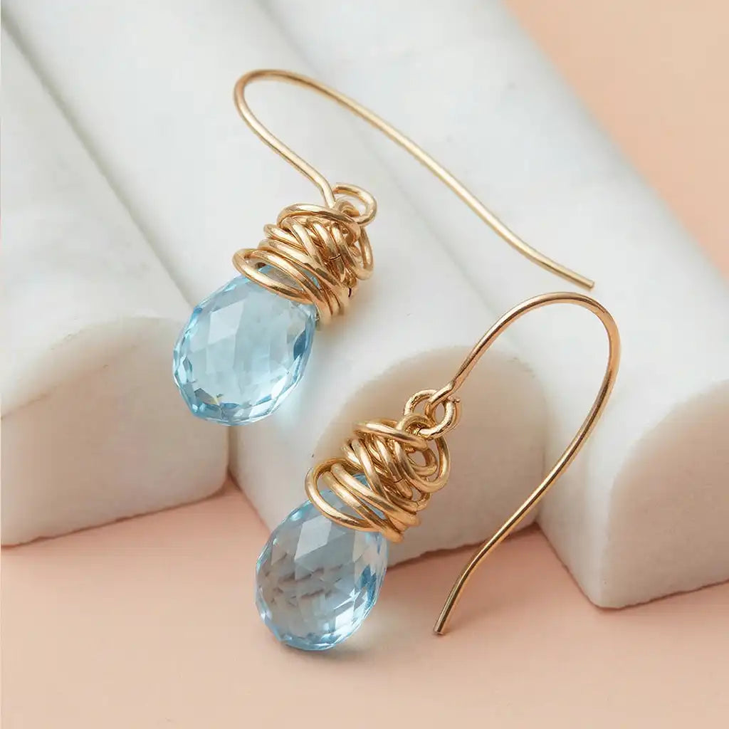 Swiss blue topaz stud earrings in 14K gold, handcrafted in Colorado