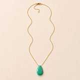 Chrysoprase long pendant necklace, hand-cut briolette on an adjustable rolo chain, flat lay