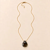 Smokey Topaz long pendant necklace, hand-cut briolette on an adjustable rolo chain, flat lay