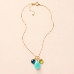 'Nora' custom 3 gem necklace in gold with three green gemstones on an adjustable chain