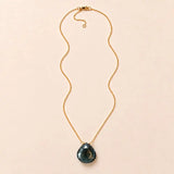 London Blue Topaz long pendant necklace, hand-cut briolette on an adjustable rolo chain, flat lay