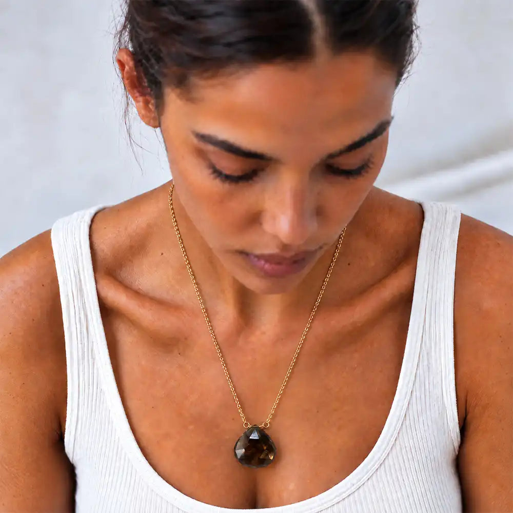 Smokey Topaz long pendant necklace on model, close view of the briolette pendant