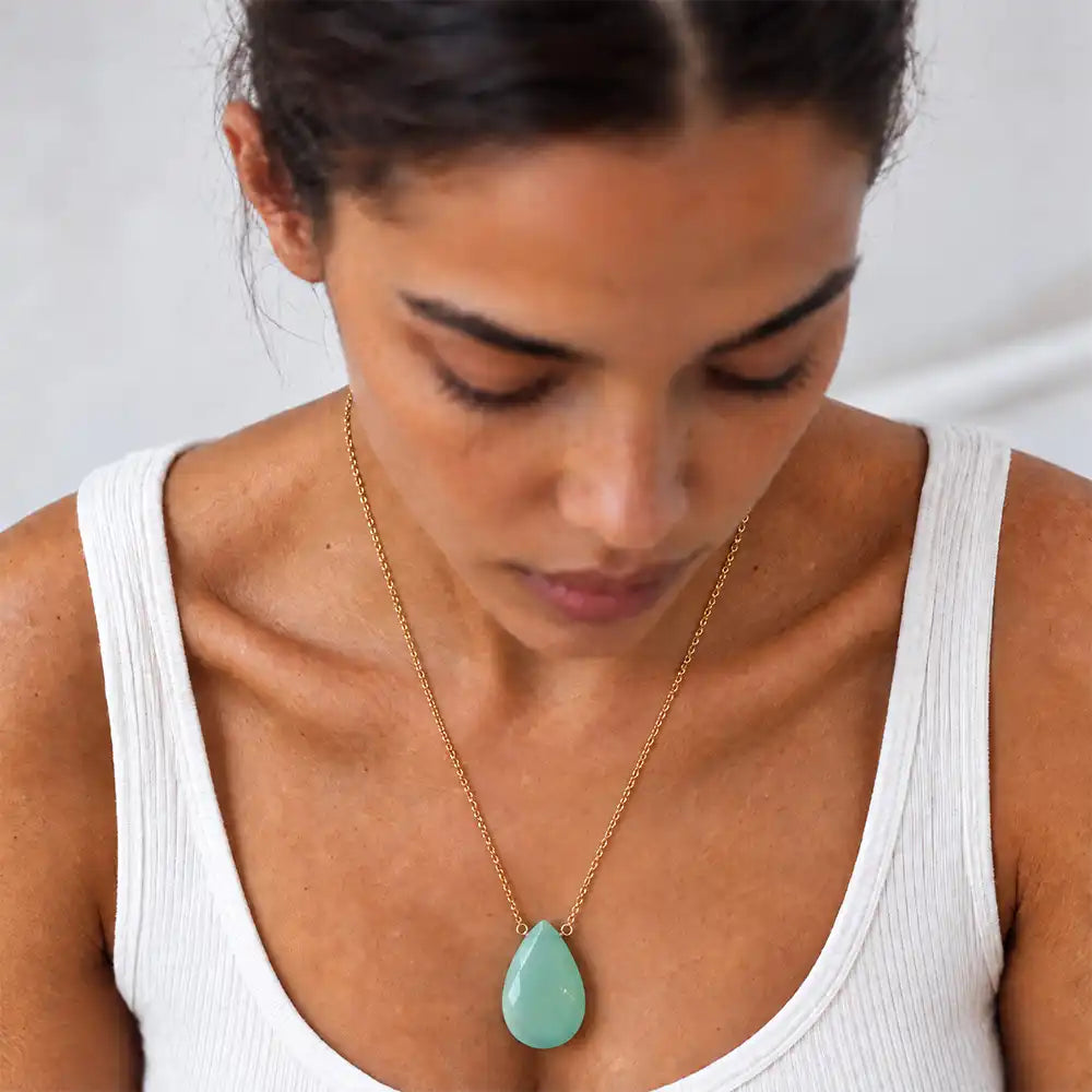Chalcedony long pendant necklace on model, close view of the briolette pendant