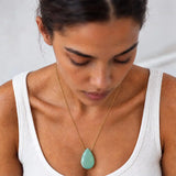 Chalcedony long pendant necklace on model, close view of the briolette pendant
