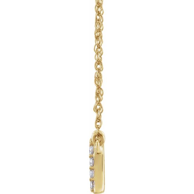 Side view of Diamond lowercase initial necklace in 14K yellow gold