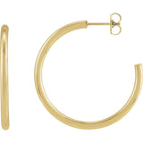 Gold hoop earrings styled with stud earring for layered look variant--14K-yellow-gold variant--30mm