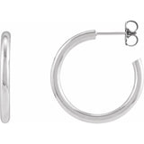 Post hoop earrings on model, front-facing portrait view variant--Sterling-silver variant--25mm