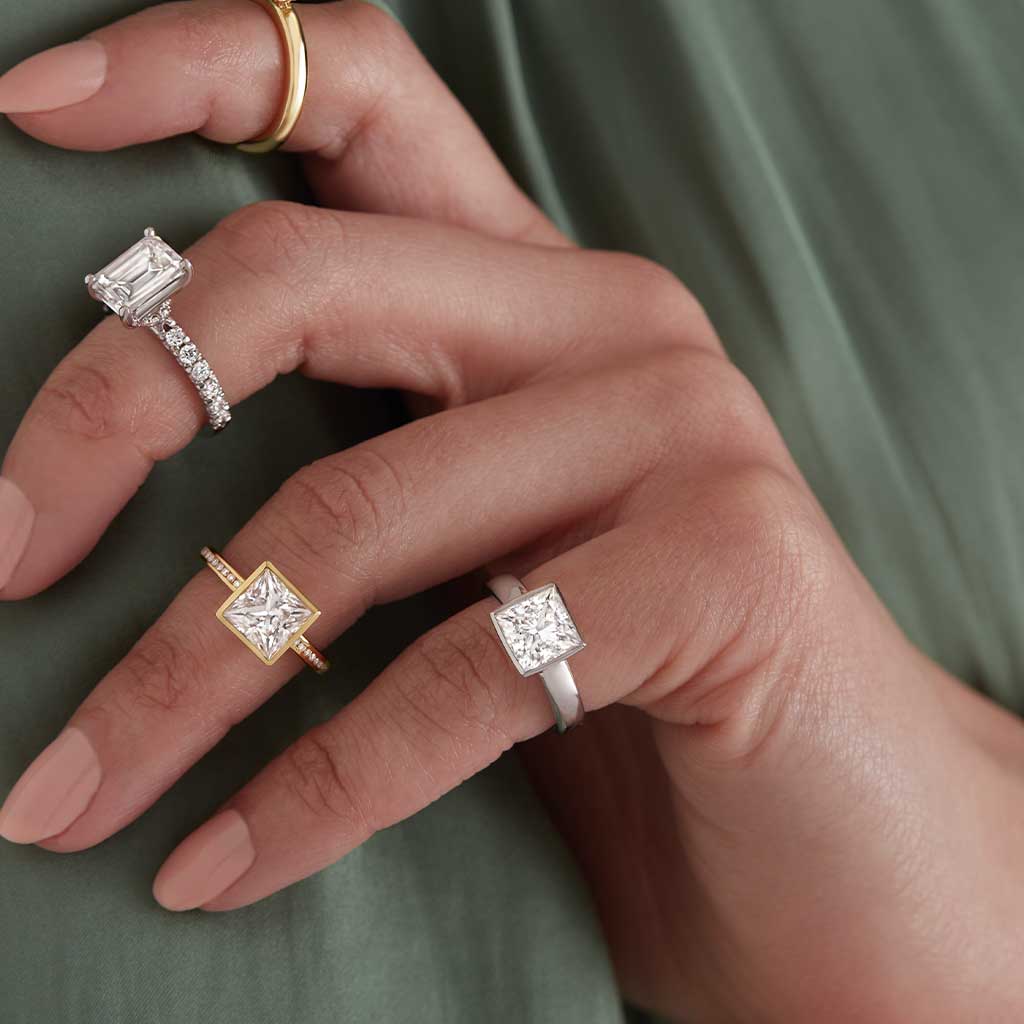 Custom bezel-set solitaire engagement ring setting in 14K white gold