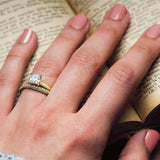 Four-prong solitaire ring setting shown on hand