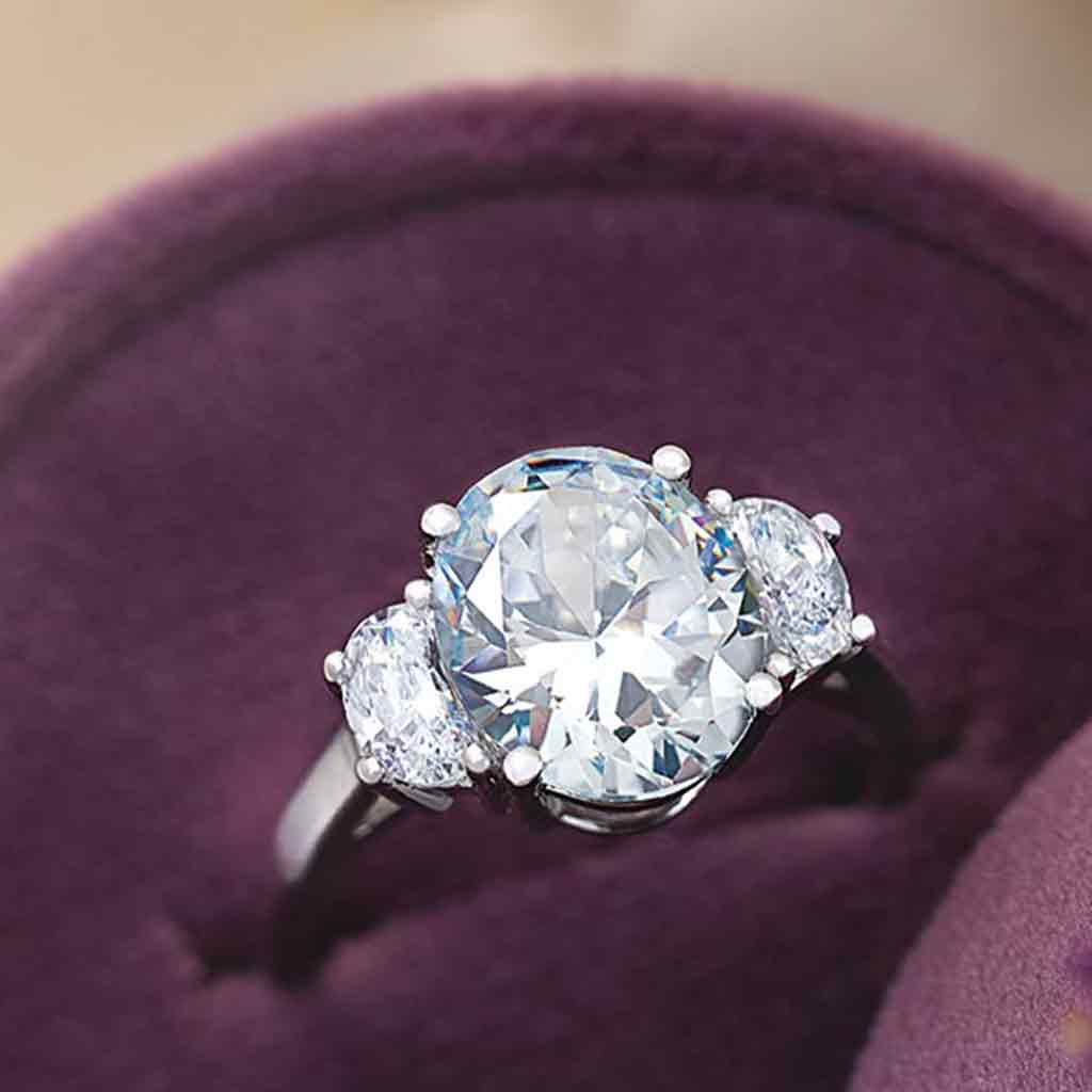 Three-stone half-moon engagement ring in 14K gold, diamond center, three-quarter angle