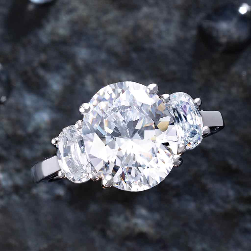 Three-stone half-moon engagement ring in 14K gold, diamond center, front view