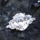 Three-stone half-moon engagement ring in 14K gold, diamond center, front view