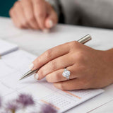 Three-stone half-moon engagement ring in 14K gold, diamond center, side profile