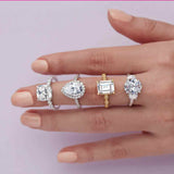 Three-stone half-moon engagement ring in 14K gold, diamond center, close-up of half-moon stones