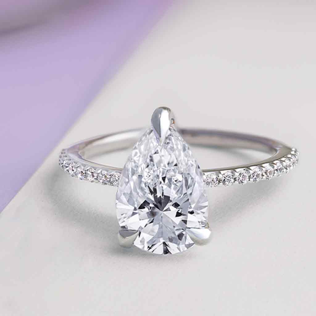 Diamond accented claw-prong engagement ring setting in 14K white gold