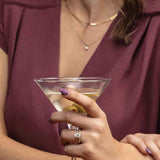 French-set halo engagement ring on model showing scale and sparkle