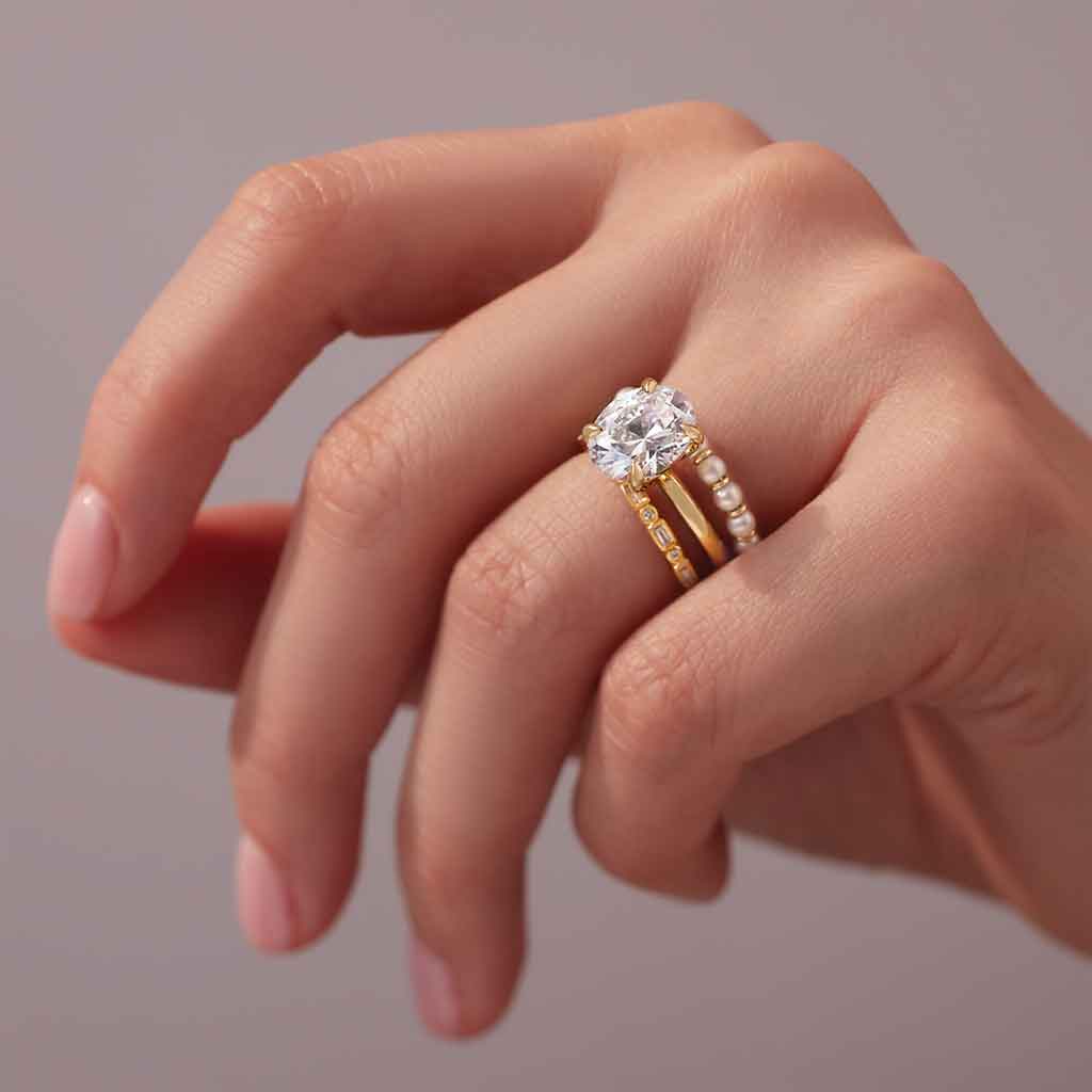 Claw-prong solitaire engagement ring setting in 14K yellow gold shown on model