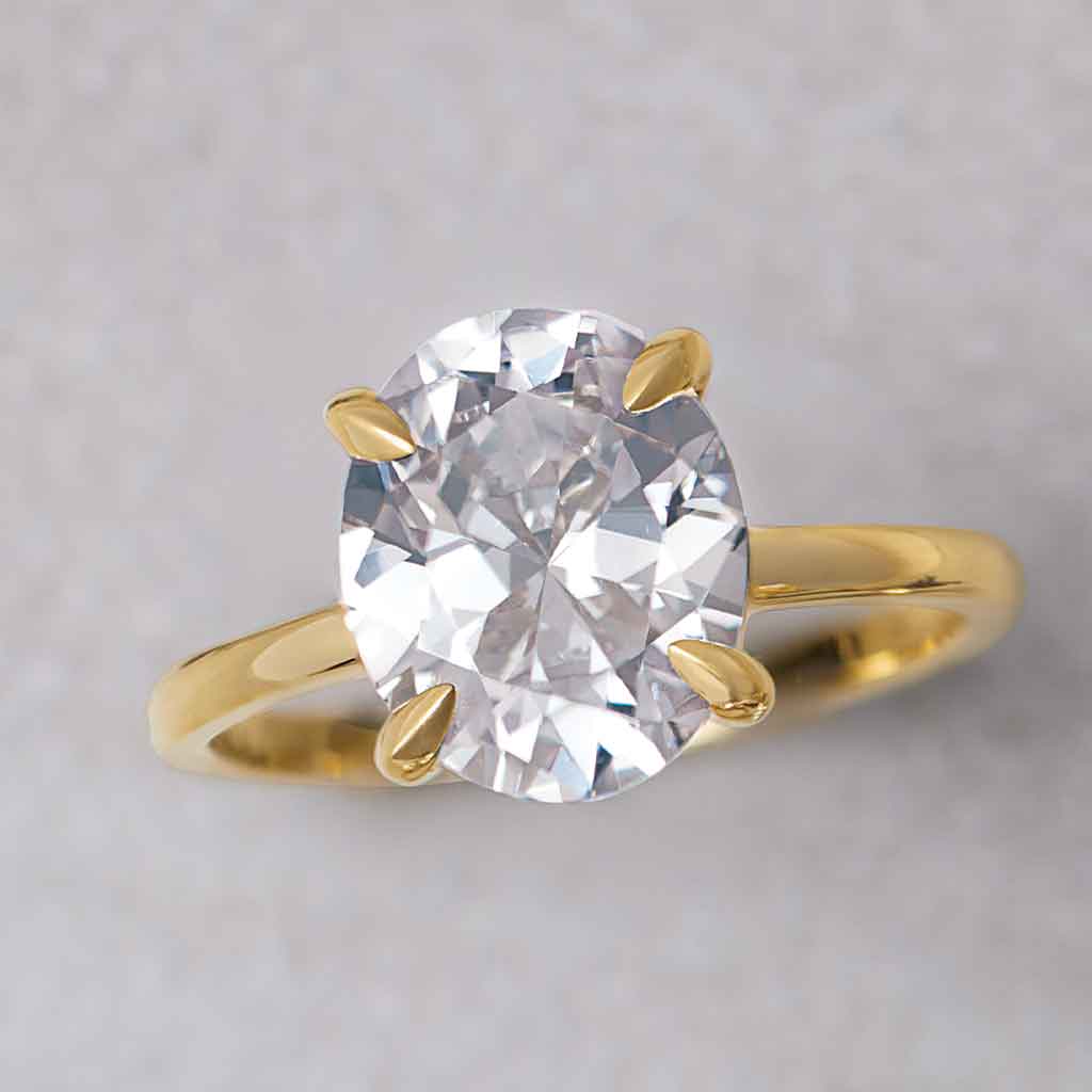 Claw-prong diamond solitaire engagement ring setting in 14K yellow gold