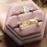 Three-stone engagement ring with round side stones in 14K gold, diamond center, overhead