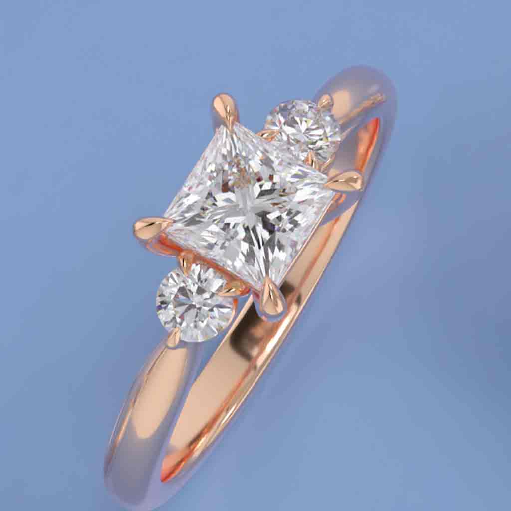 Three-stone engagement ring with round side stones in 14K gold, diamond center, front view