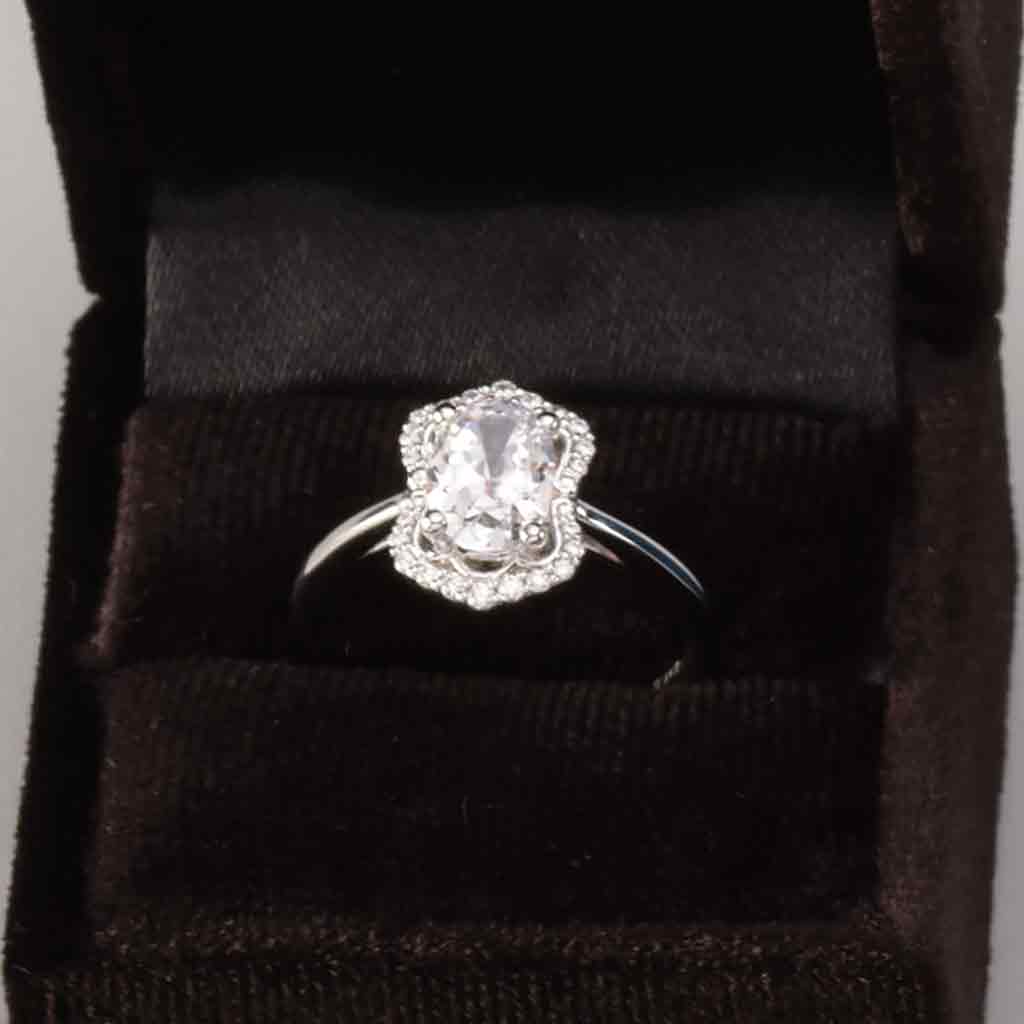 Scalloped halo diamond engagement ring in 14K gold, diamond center, on hand