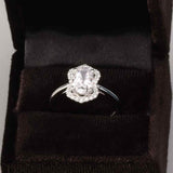 Scalloped halo diamond engagement ring in 14K gold, diamond center, on hand