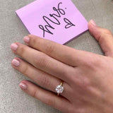 Scroll solitaire engagement ring in 14K gold, diamond center, three-quarter angle
