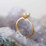 Scroll solitaire engagement ring in 14K gold, diamond center, front view
