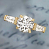 Three-stone baguette side stone ring in 14K gold, diamond center, front view