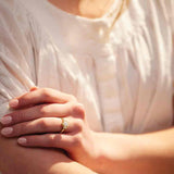 Diamond cluster ring setting with pear center stone shown on model