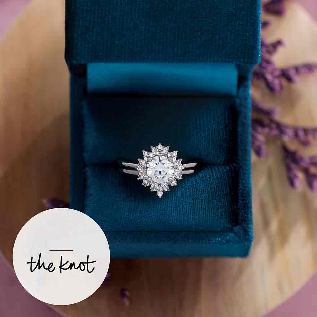Floral halo engagement ring detail showing petal-like diamond arrangement