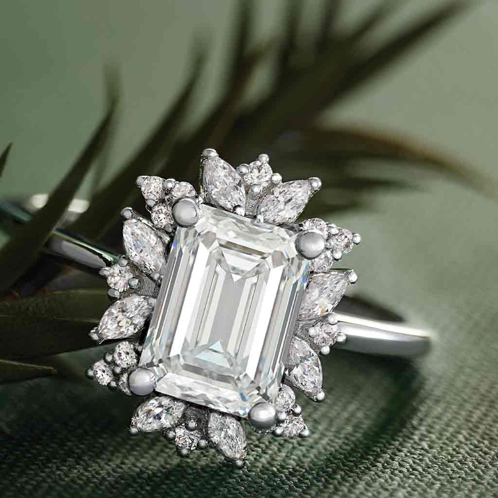 Floral halo diamond engagement ring with emerald-cut center in 14K gold, editorial view