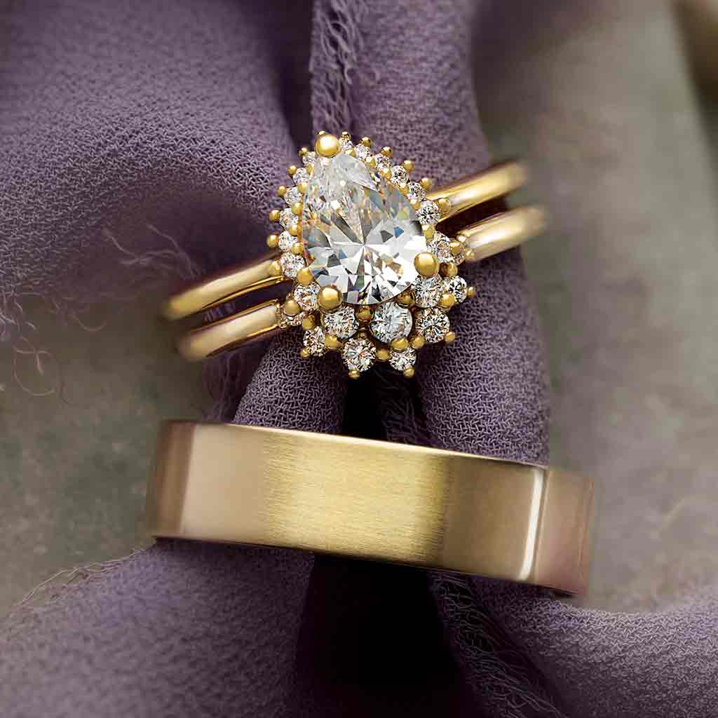 Saddle halo diamond engagement ring setting in 14K gold, diamond center, side profile