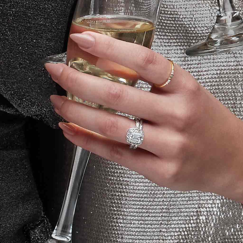 Milgrain vintage engagement ring on model hand