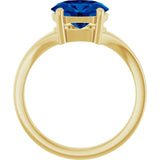 Oval sapphire gemstone ring, three-quarter view showing band and setting