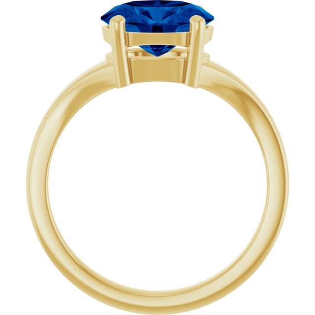 Oval sapphire gemstone ring, three-quarter view showing band and setting