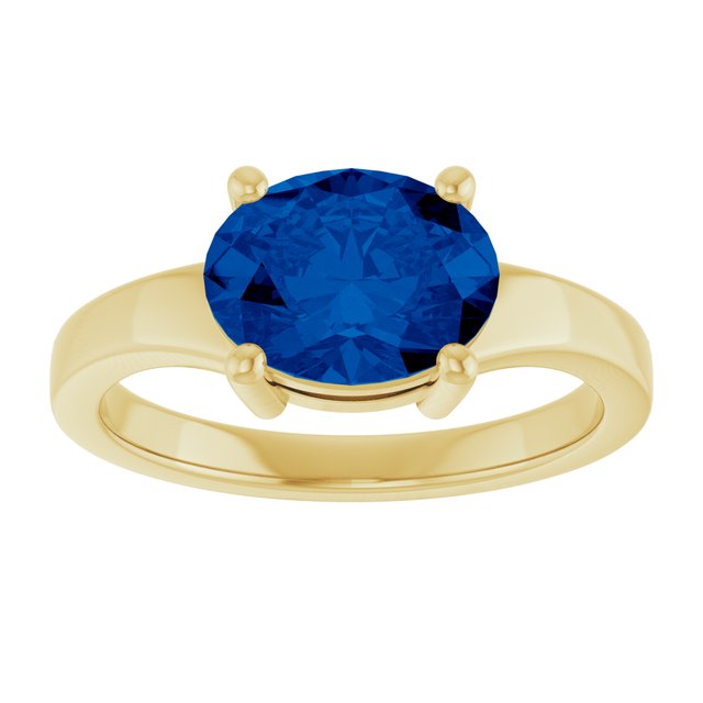 Oval sapphire cocktail ring in 14K white gold, angled view showing stone depth