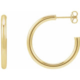 Post hoop earrings on ear showing comfortable fit variant--14K-yellow-gold variant--25mm