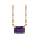 Modern 14K rose gold necklace featuring vertical emerald-cut amethyst gemstone for birth month elegance