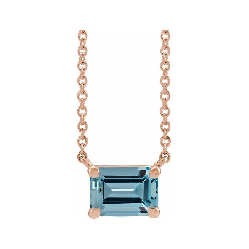 Handcrafted vertical aquamarine gemstone necklace in polished 14K rose gold‚Äîa modern birthstone keepsake