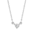 Minimalist 14K gold necklace with a small round diamond gemstone pendant.